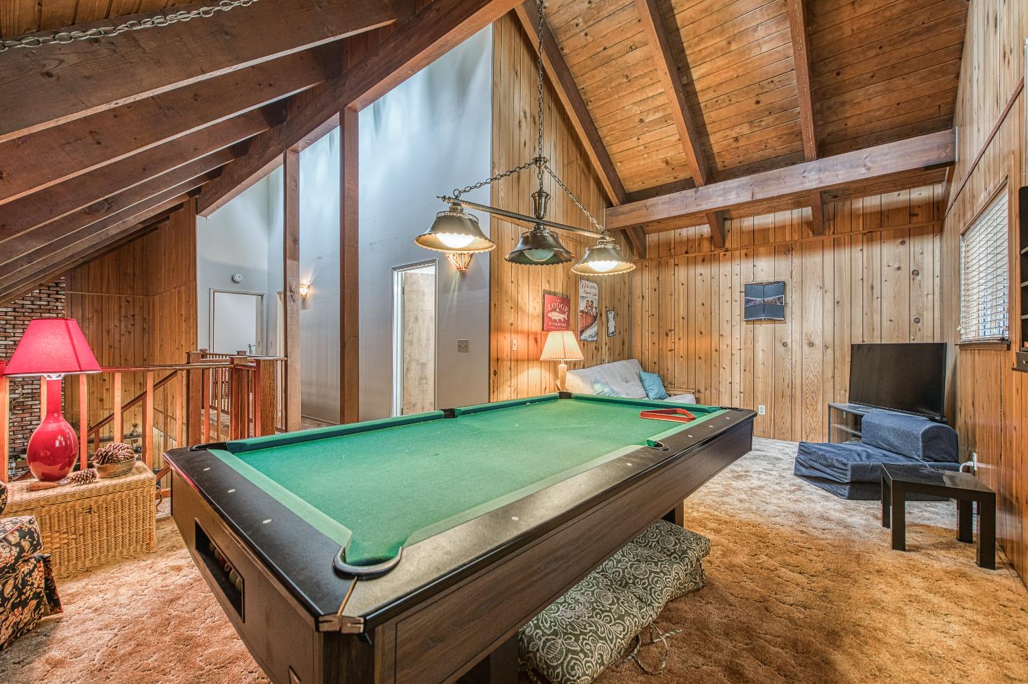 42303 Hanging Branch Road Shaver Lake, CA 93664 - Photo 27 of 39 a room with pool table and a rug