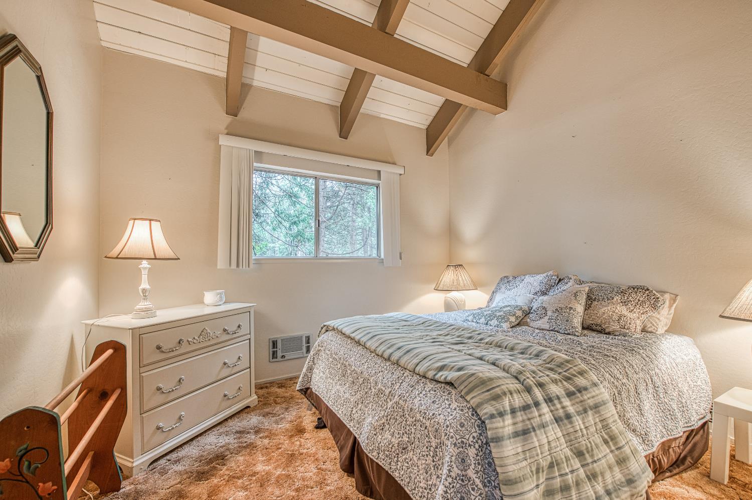 42303 Hanging Branch Road Shaver Lake, CA 93664 - Photo 30 of 39 a bedroom with a bed and a lamp on dresser