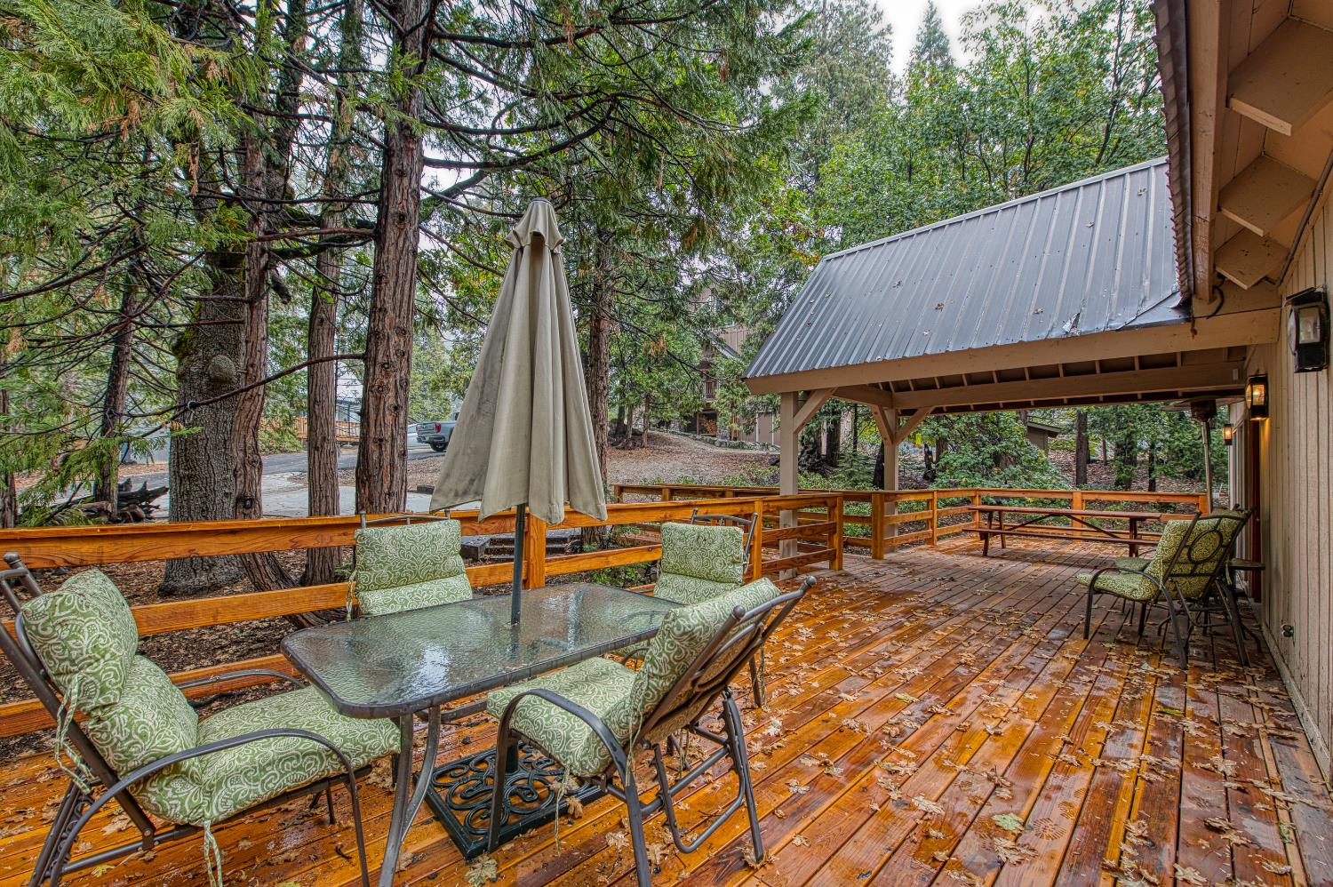 42303 Hanging Branch Road Shaver Lake, CA 93664 - Photo 37 of 39 an outdoor sitting area with furniture and wooden floor