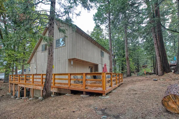 a living room with fireplace furniture and a fireplace