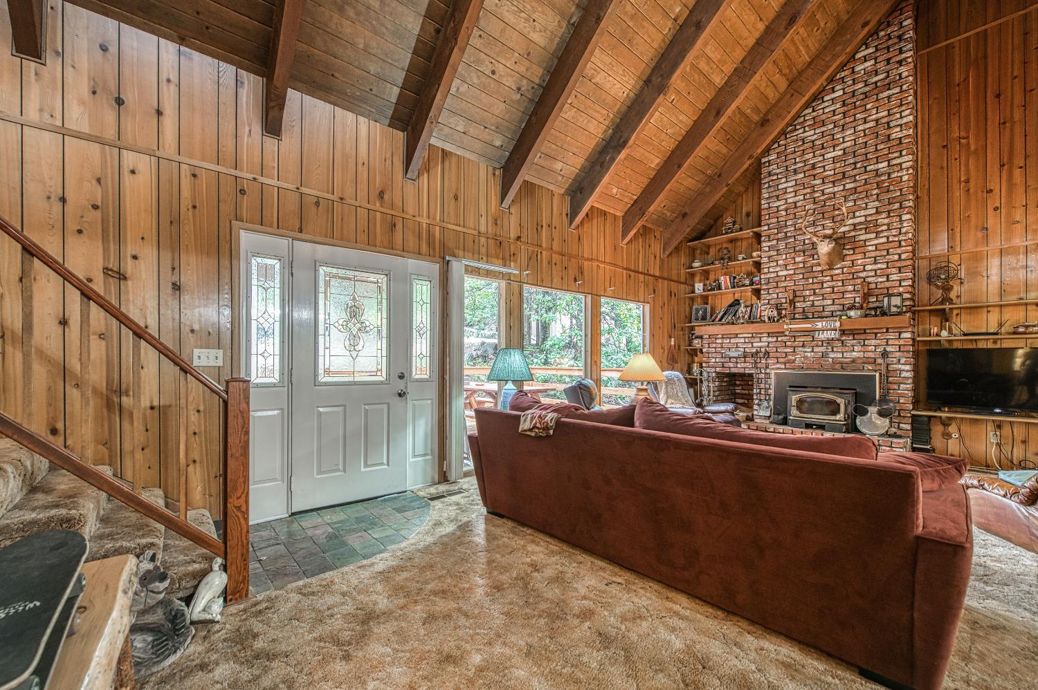 42303 Hanging Branch Road Shaver Lake, CA 93664 - Photo 8 of 39 a living room with fireplace furniture and a floor to ceiling window