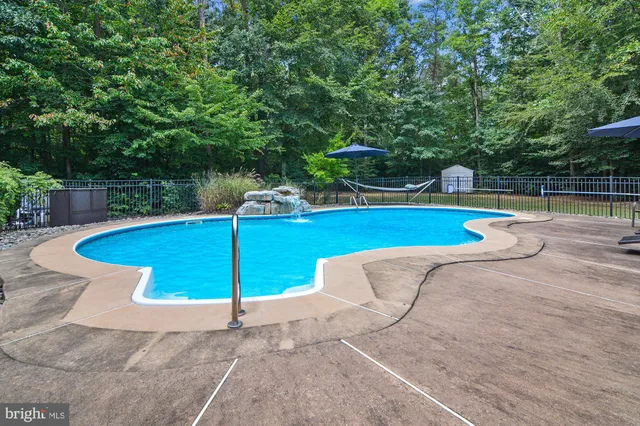 a view of a swimming pool with a patio