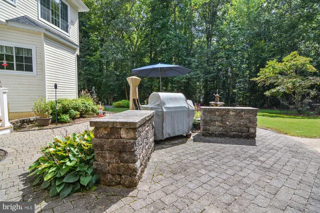 a view of a garden with furniture