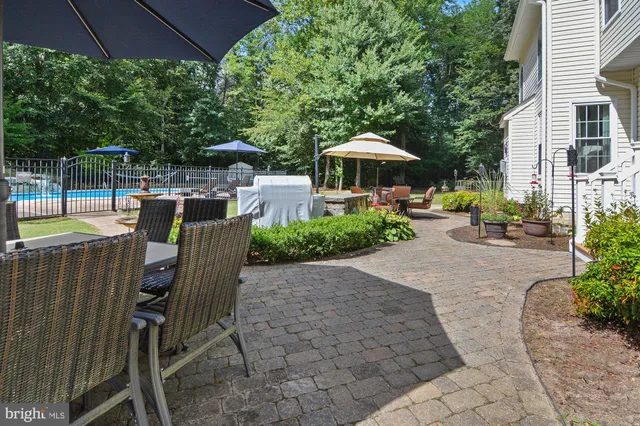 a view of a chairs and table under an umbrella