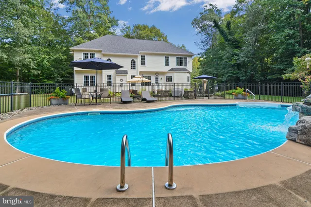 a view of a house with swimming pool