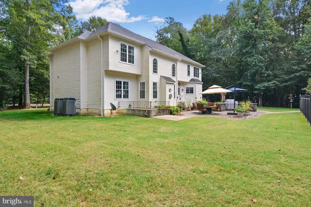 a front view of house with yard and seating area