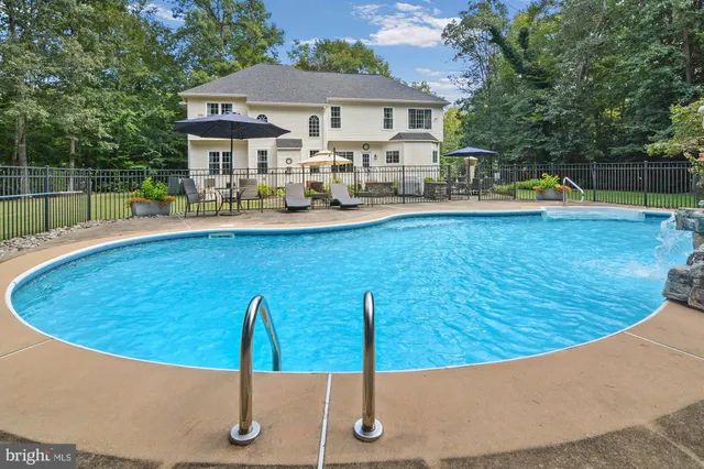 a view of a house with swimming pool
