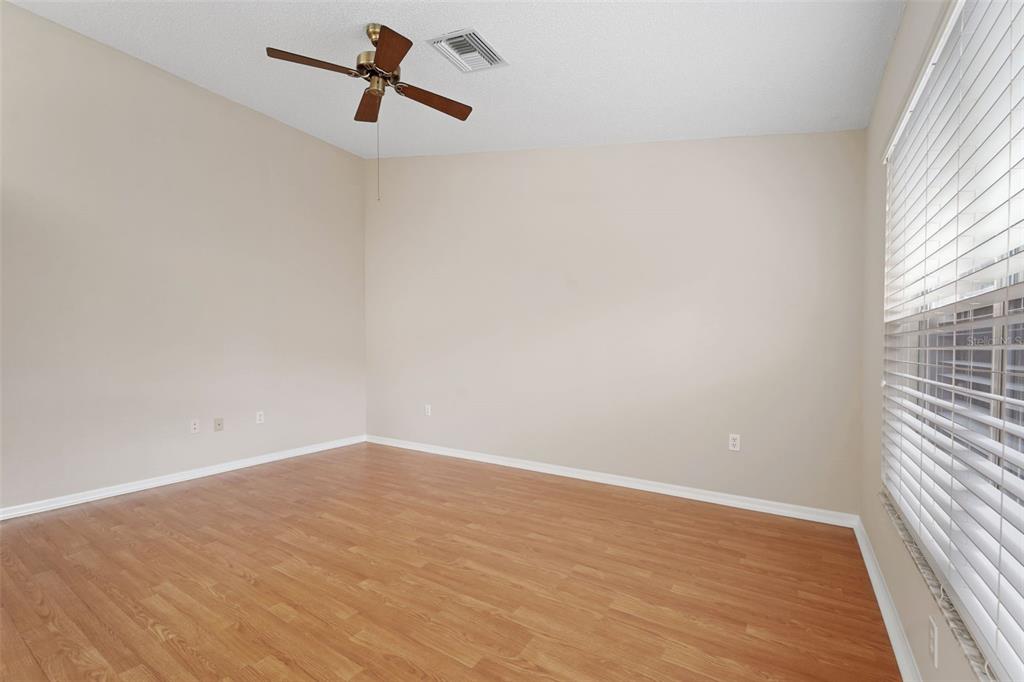 1031 Almondwood Drive Trinity, FL 34655 - Photo 14 of 49 wooden floor in an empty room with a window