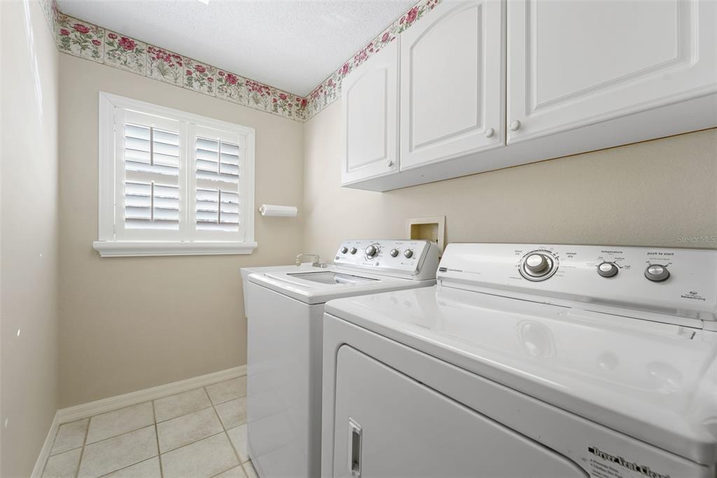 1031 Almondwood Drive Trinity, FL 34655 - Photo 22 of 49 a utility room with dryer and washer