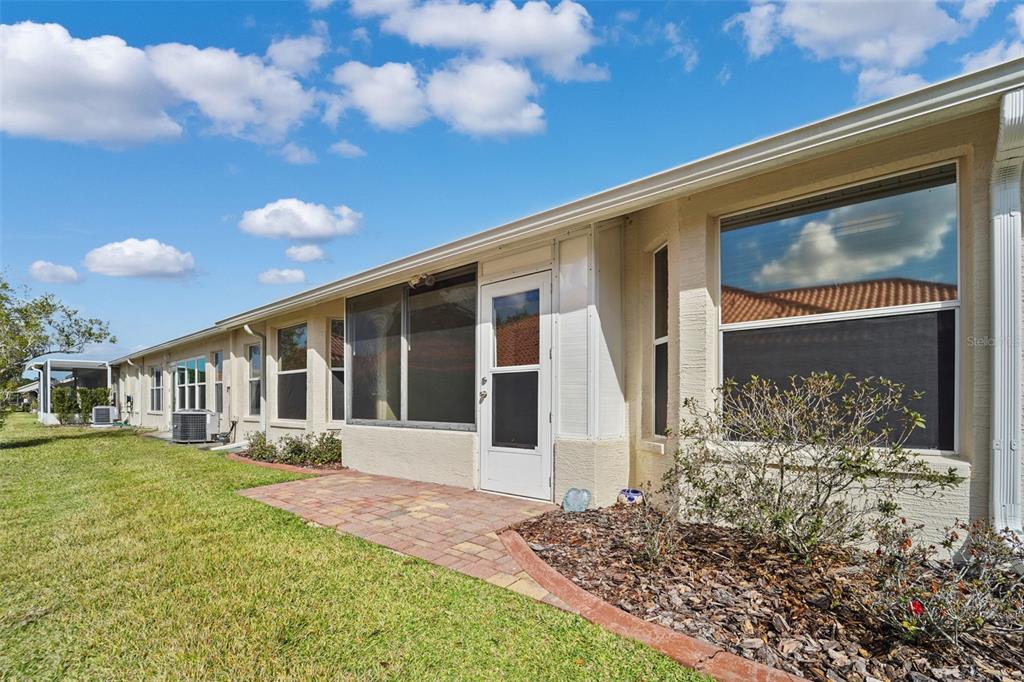 1031 Almondwood Drive Trinity, FL 34655 - Photo 25 of 49 a front view of a house with a yard