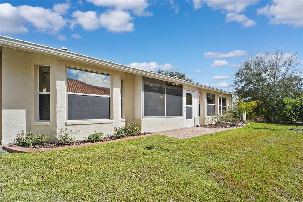 1031 Almondwood Drive Trinity, FL 34655 - Photo 26 of 49 a front view of a house with garden