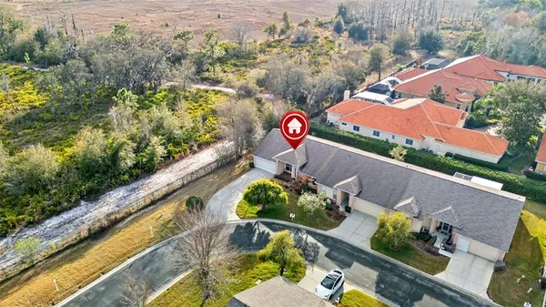 an aerial view of a house with a swimming pool