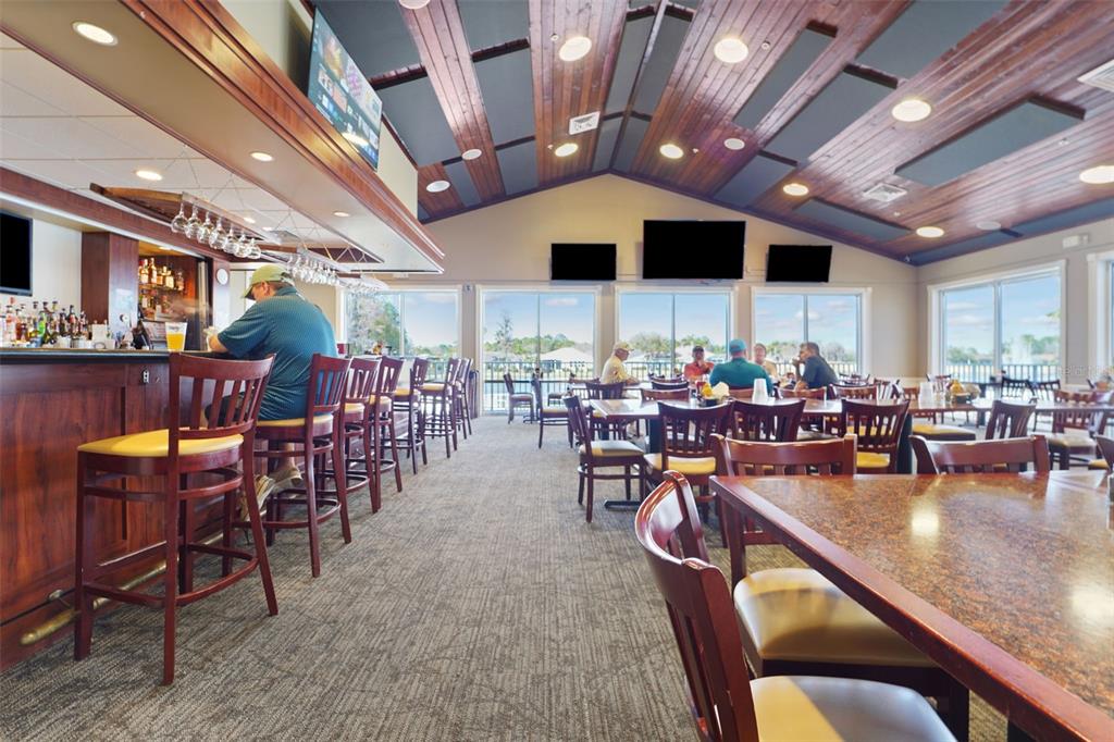 1031 Almondwood Drive Trinity, FL 34655 - Photo 37 of 49 a group of people sitting at tables in a room