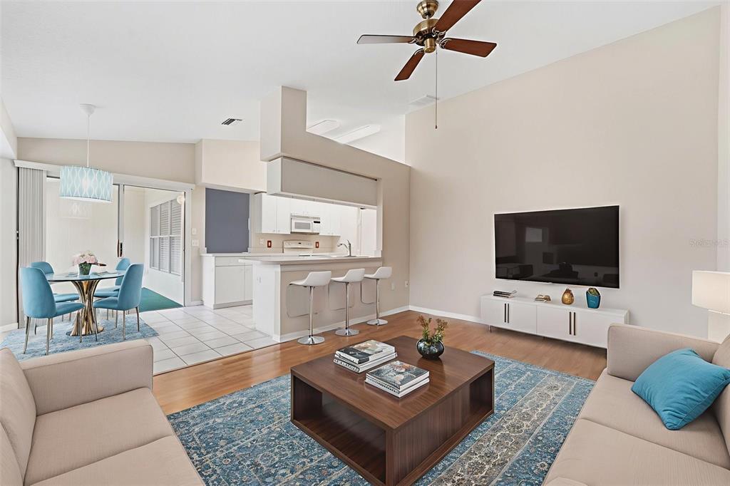 1031 Almondwood Drive Trinity, FL 34655 - Photo 4 of 49 a living room with furniture and a flat screen tv