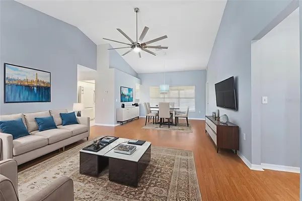 a living room with furniture and a flat screen tv