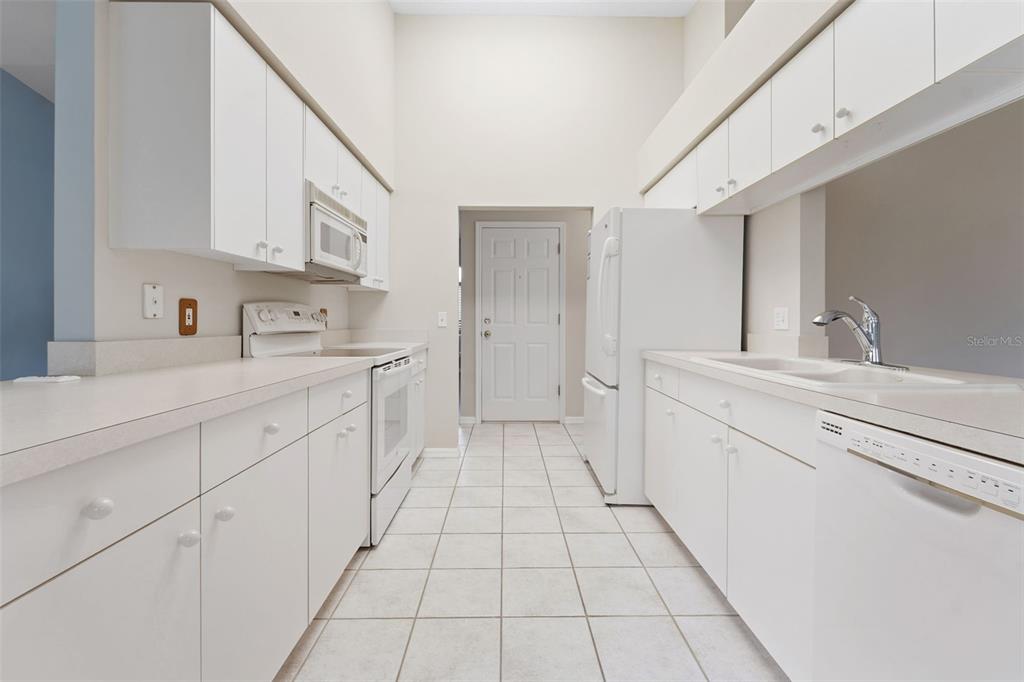 1031 Almondwood Drive Trinity, FL 34655 - Photo 10 of 49 a kitchen with a sink and cabinets
