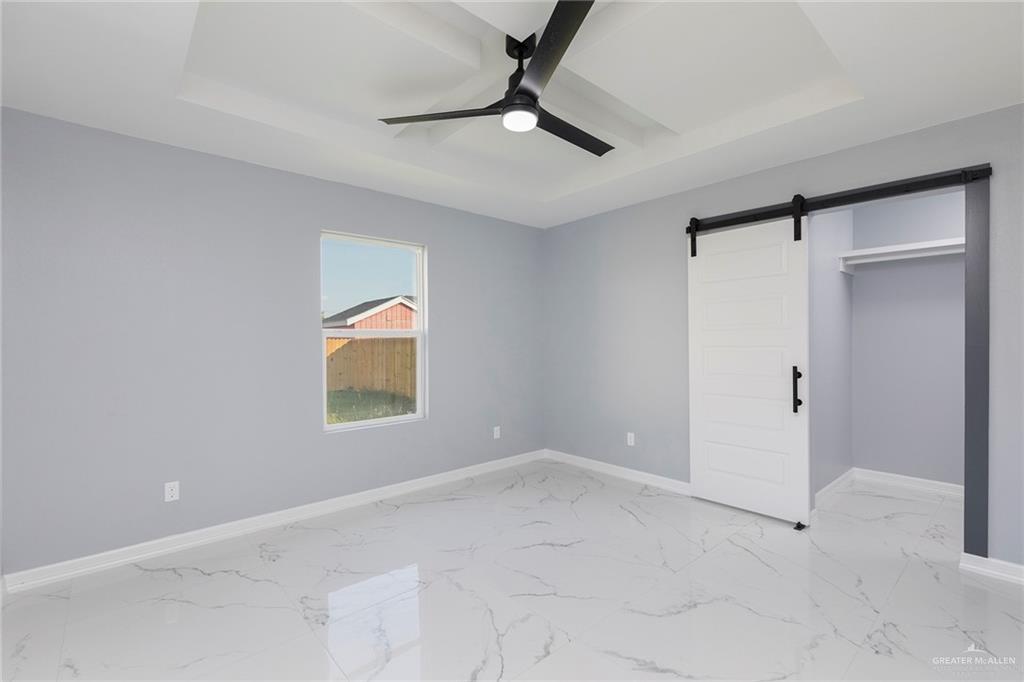 6809 South Oro Lane Pharr, TX 78577 - Photo 14 of 17 a view of an empty room with a window