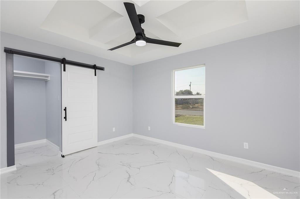 6809 South Oro Lane Pharr, TX 78577 - Photo 15 of 17 a view of an empty room with a window