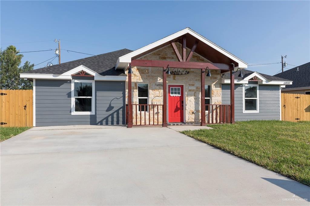 6809 South Oro Lane Pharr, TX 78577 - Photo 2 of 17 a front view of a house with a yard