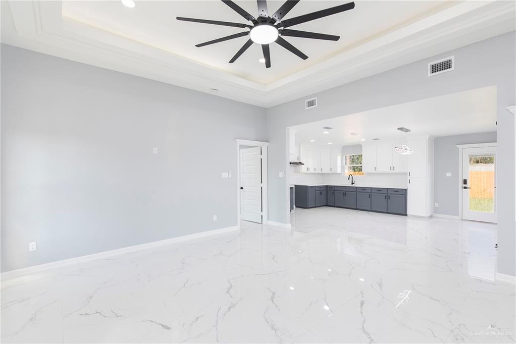 6809 South Oro Lane Pharr, TX 78577 - Photo 4 of 17 a view of an empty room and kitchen view