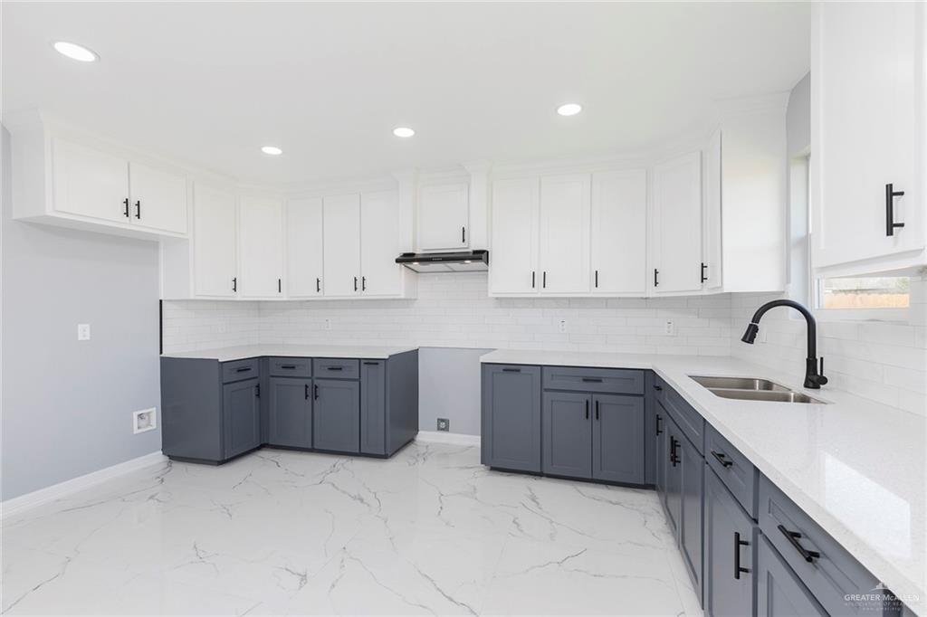 6809 South Oro Lane Pharr, TX 78577 - Photo 7 of 17 a kitchen with stainless steel appliances granite countertop a sink a stove a refrigerator and cabinets