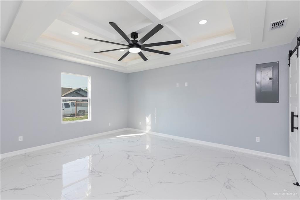 6809 South Oro Lane Pharr, TX 78577 - Photo 10 of 17 an empty room with windows and fan