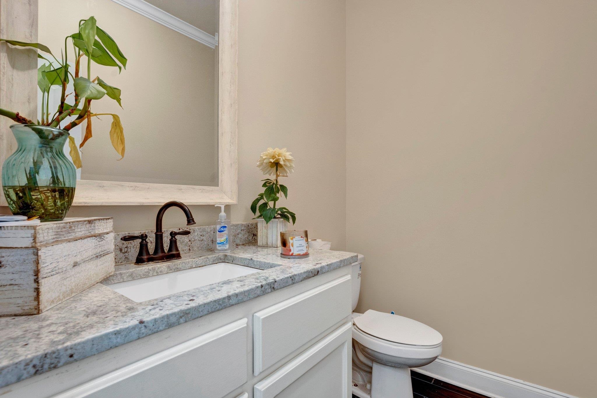 3270 Rast Road Millington, TN 38053 - Photo 20 of 40 Half bath with vanity, crown molding, and dark wood-style flooring