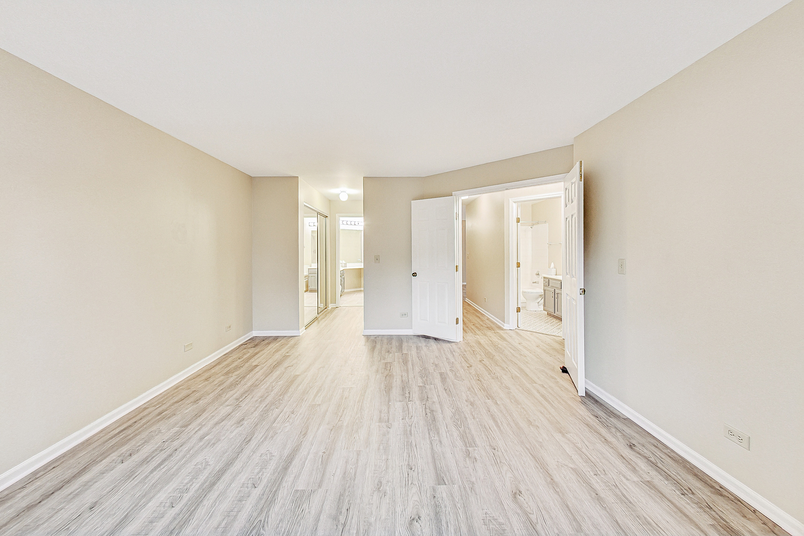 1006 Butternut Lane, Unit B Mount Prospect, IL 60056 - Photo 14 of 26 a view of an empty room with wooden floor