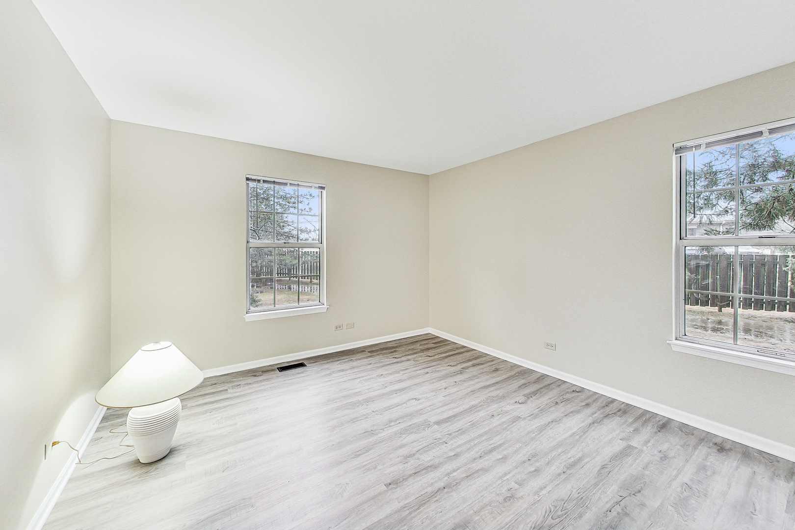 1006 Butternut Lane, Unit B Mount Prospect, IL 60056 - Photo 16 of 26 a view of empty room with wooden floor and fan