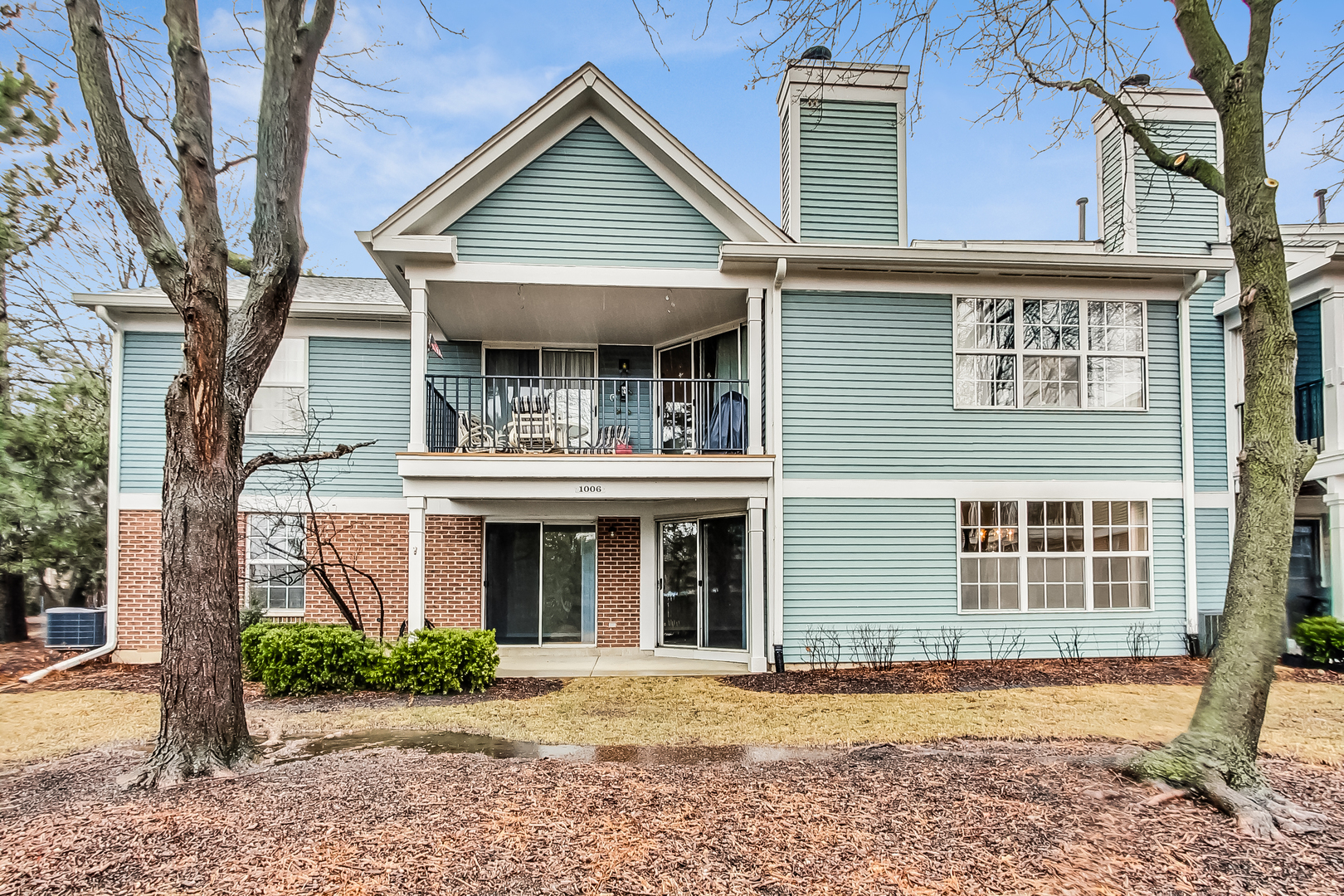 1006 Butternut Lane, Unit B Mount Prospect, IL 60056 - Photo 17 of 26 front view of a building with a garden
