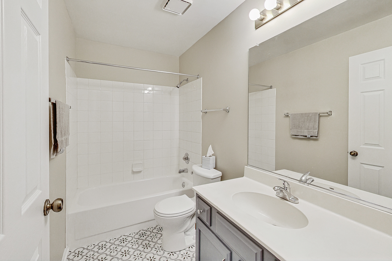 1006 Butternut Lane, Unit B Mount Prospect, IL 60056 - Photo 20 of 26 a bathroom with a sink toilet and shower