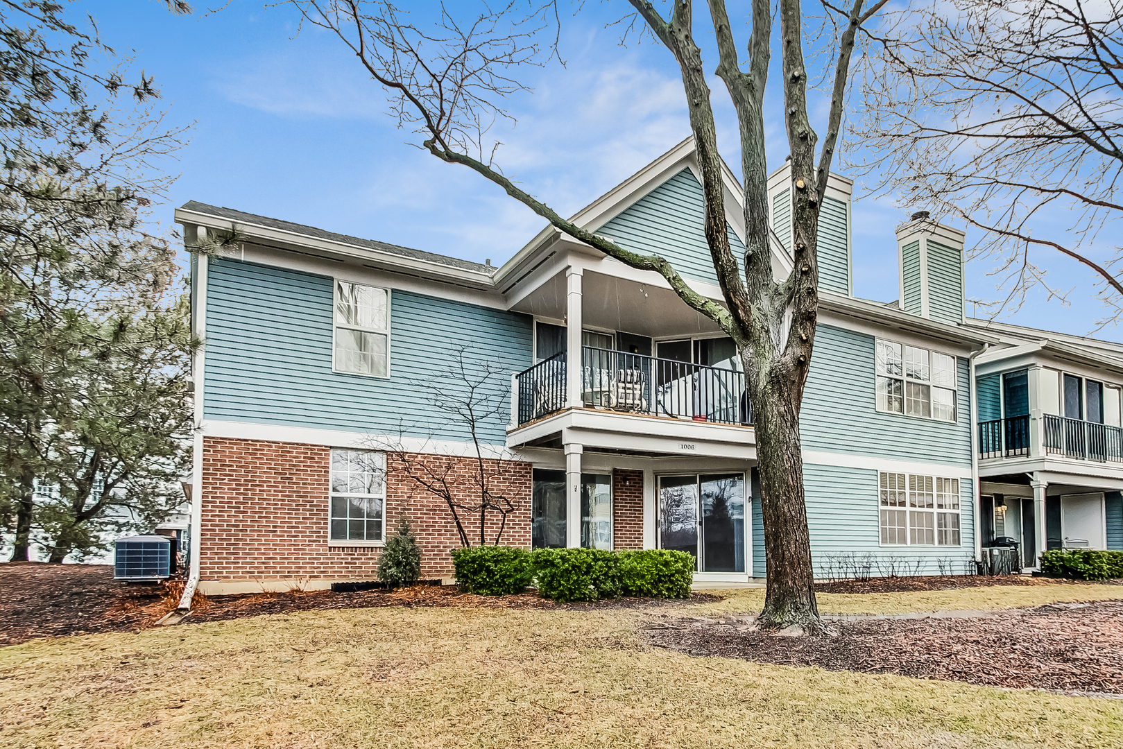 1006 Butternut Lane, Unit B Mount Prospect, IL 60056 - Photo 23 of 26 a front view of a house with a yard