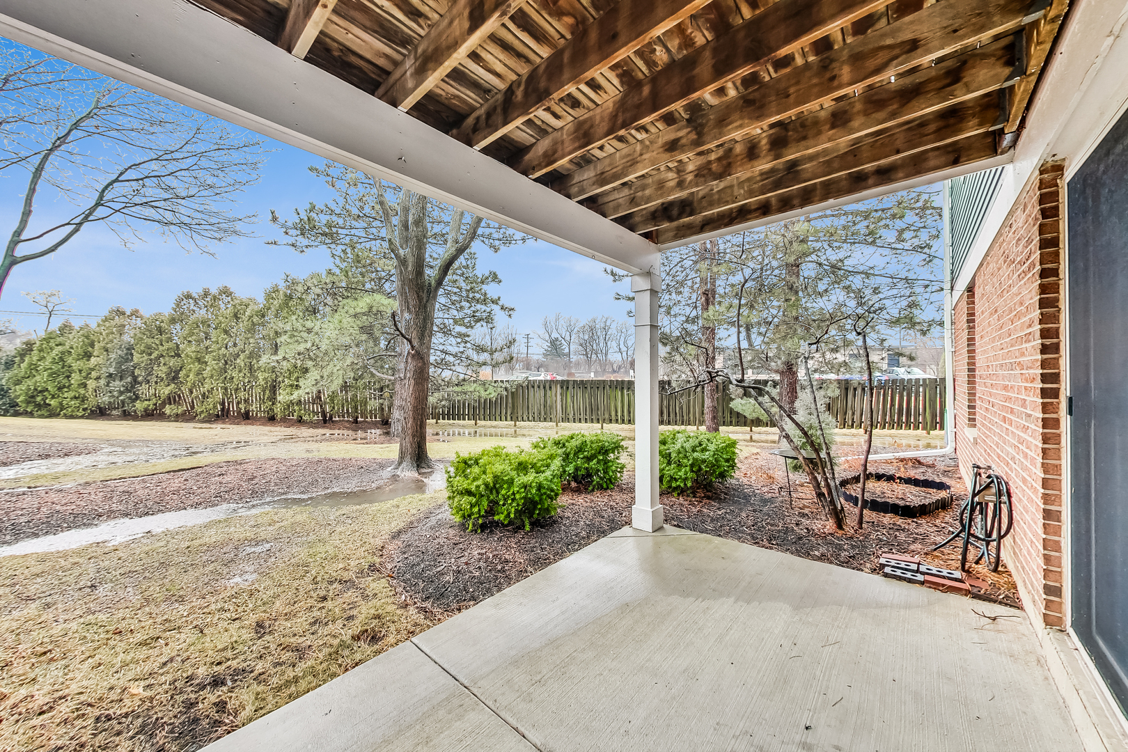 1006 Butternut Lane, Unit B Mount Prospect, IL 60056 - Photo 25 of 26 a view of a patio with a table and chairs next to a yard