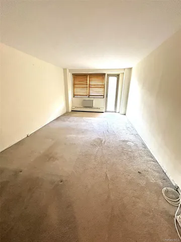 a kitchen with a refrigerator and a stove top oven