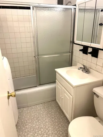 a view of an empty room with closet