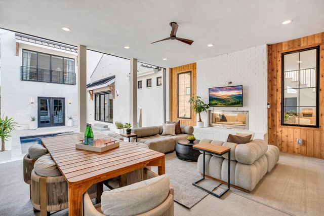 a bathroom with a double vanity sink mirror and bathtub