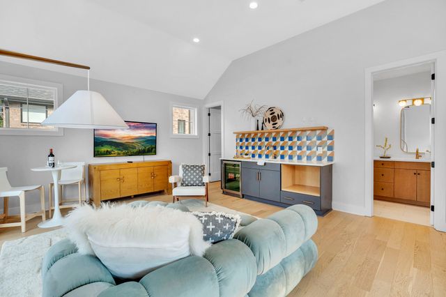 a bedroom with a bed and a chair