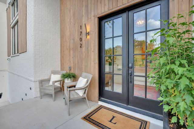 a bed room with a bed and a large window