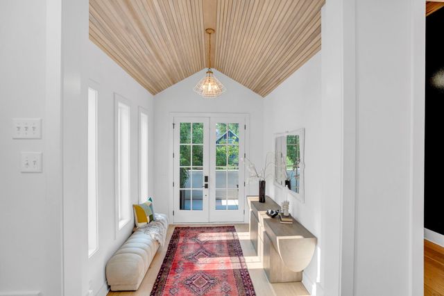 a living room with furniture or couch and a potted plant