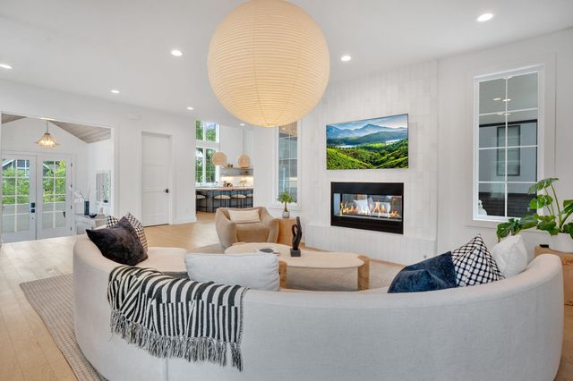a view of a room with a floor to ceiling window and an iron gate