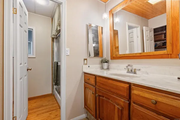 a bathroom with a double vanity sink and mirror