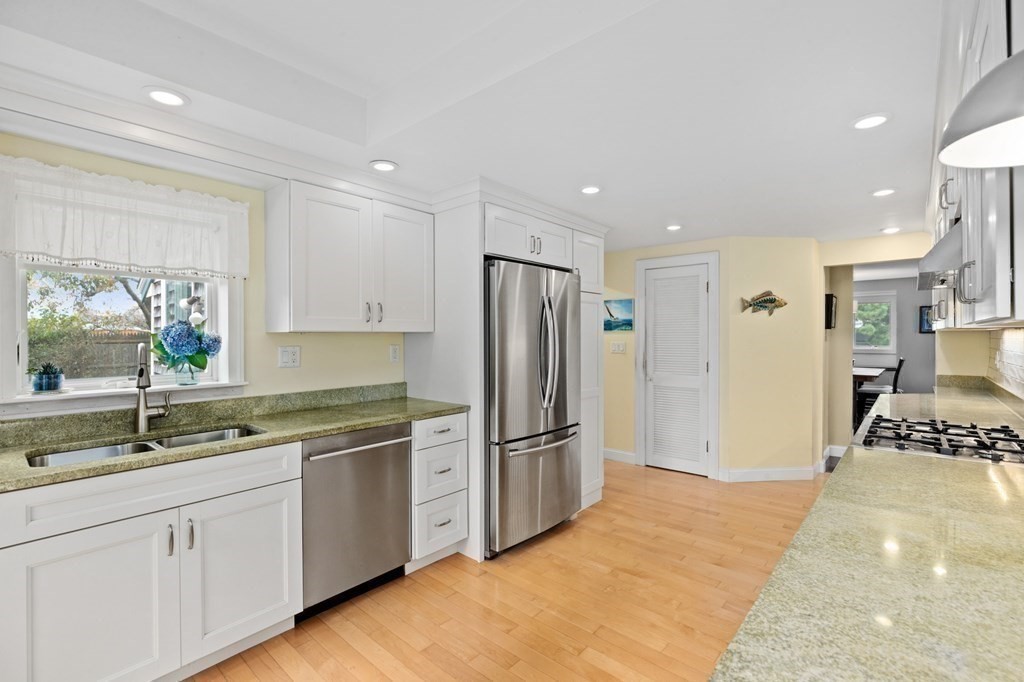 21 5th Avenue Scituate, MA 02066 - Photo 12 of 40 a kitchen with stainless steel appliances granite countertop a refrigerator and a sink
