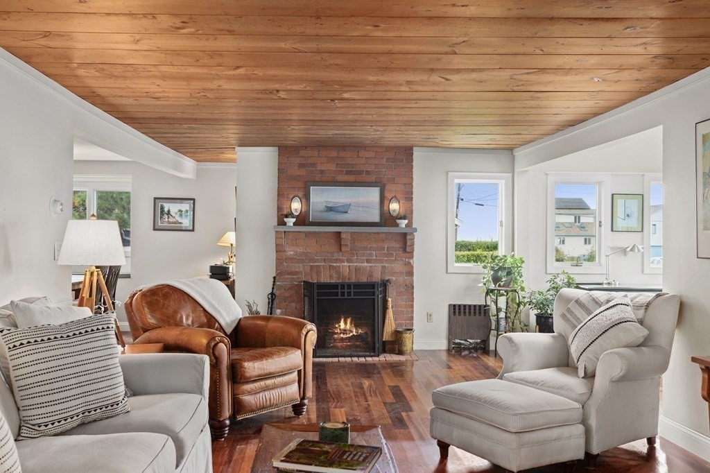 21 5th Avenue Scituate, MA 02066 - Photo 19 of 40 a living room with furniture and a fireplace