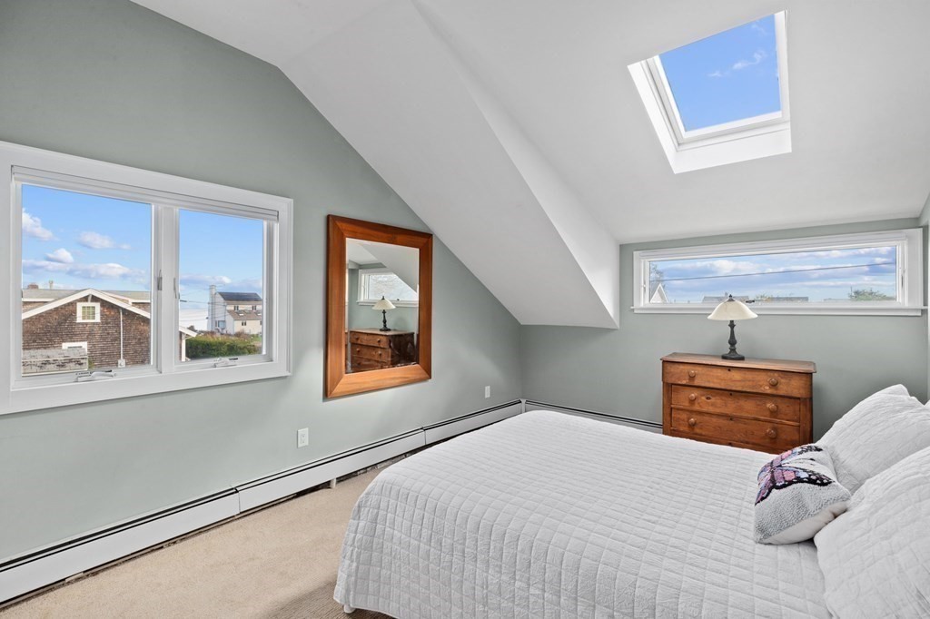 21 5th Avenue Scituate, MA 02066 - Photo 26 of 40 a bedroom with a bed and a large window