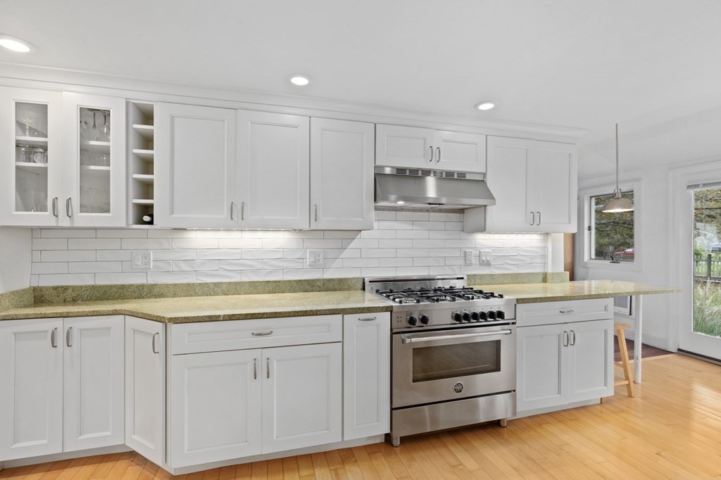 21 5th Avenue Scituate, MA 02066 - Photo 5 of 40 a kitchen with white cabinets stainless steel appliances and sink