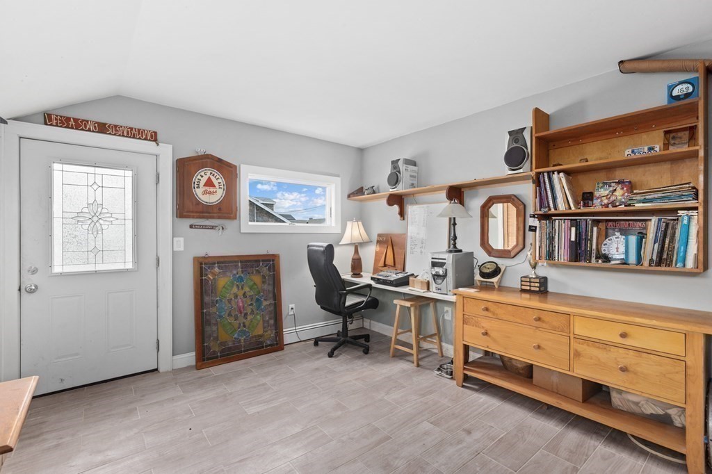 21 5th Avenue Scituate, MA 02066 - Photo 9 of 40 a view of a livingroom with furniture and a fireplace
