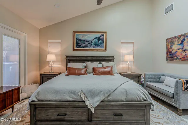 a bedroom with a bed and a couch