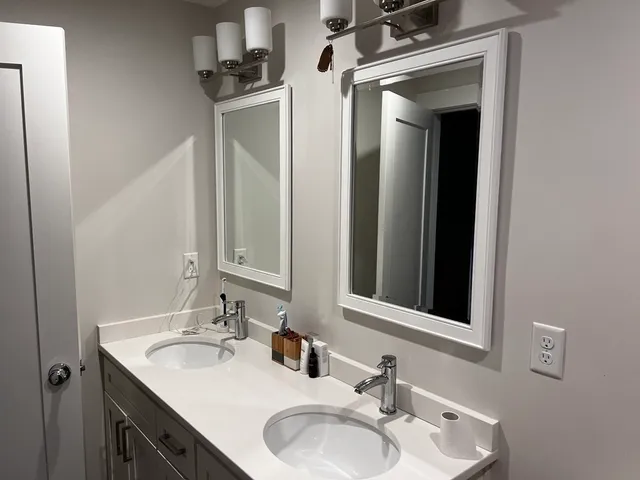 a bathroom with a sink and a mirror