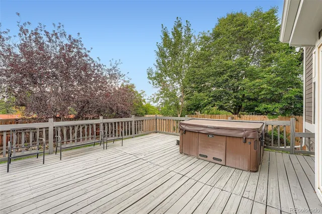 a view of a deck with table and chairs and wooden floor