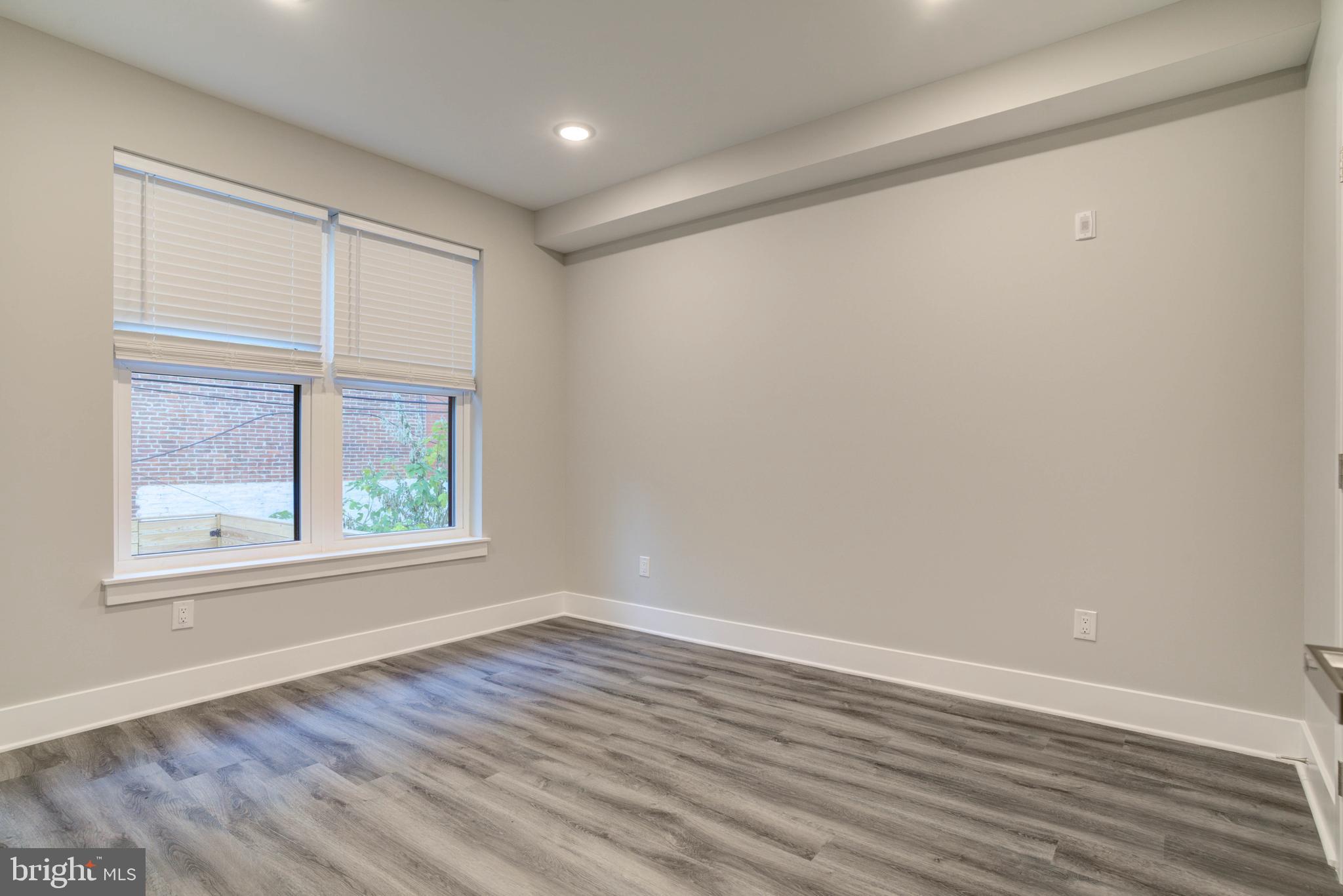 5005 Walnut Street Philadelphia, PA 19139 - Photo 13 of 39 wooden floor in an empty room with a window
